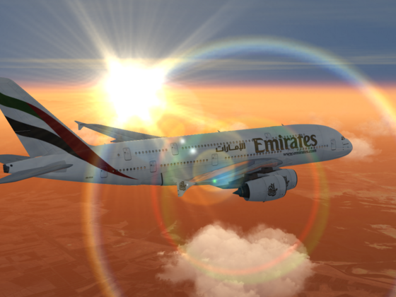Emirates A380 flying past the sunrise