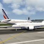 A220 takes off close to an Air France 777